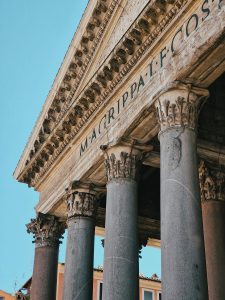 a close up of a building Pantheon with columns and a sky background